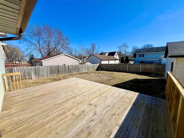 deck featuring a residential view and a fenced backyard