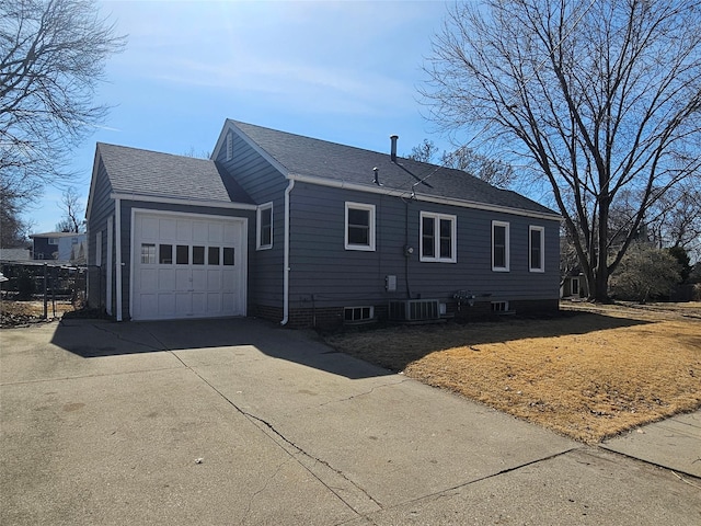 view of property exterior featuring an attached garage, driveway, and roof with shingles