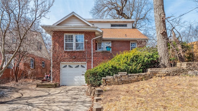 view of front of house featuring brick siding, concrete driveway, a garage, and roof with shingles