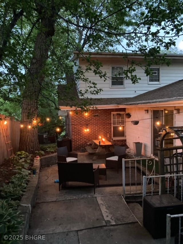 view of patio with outdoor lounge area and fence