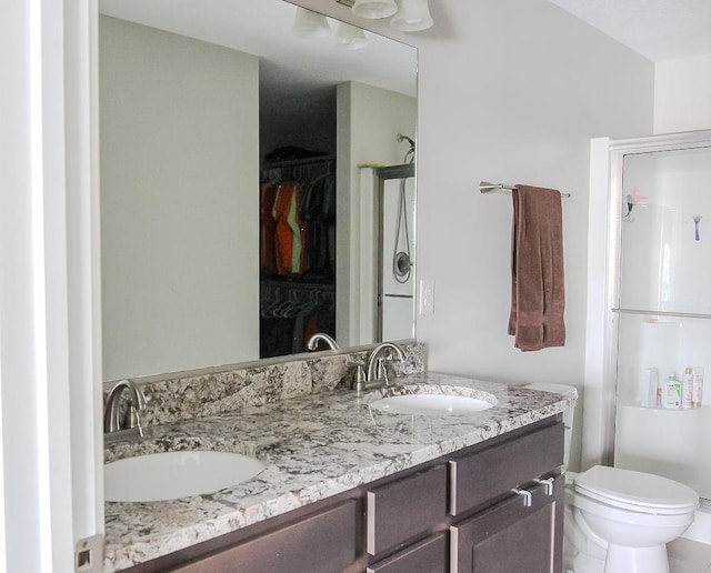 full bath featuring a sink and a shower stall