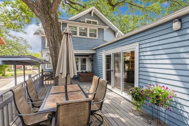 wooden deck with outdoor dining area