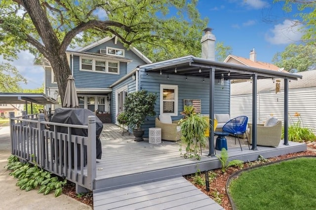 back of property featuring a wooden deck