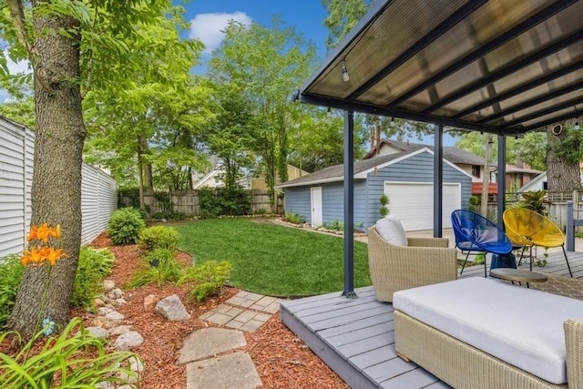 view of yard featuring a fenced backyard, a wooden deck, and an outdoor structure