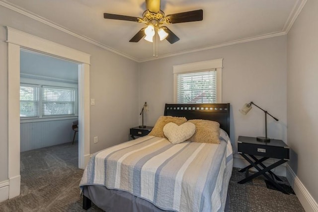 bedroom featuring dark carpet, baseboards, crown molding, and a ceiling fan