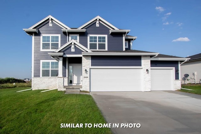 craftsman-style home with stone siding, concrete driveway, and a front lawn