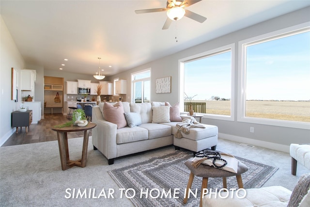 living room featuring recessed lighting, visible vents, baseboards, and a ceiling fan