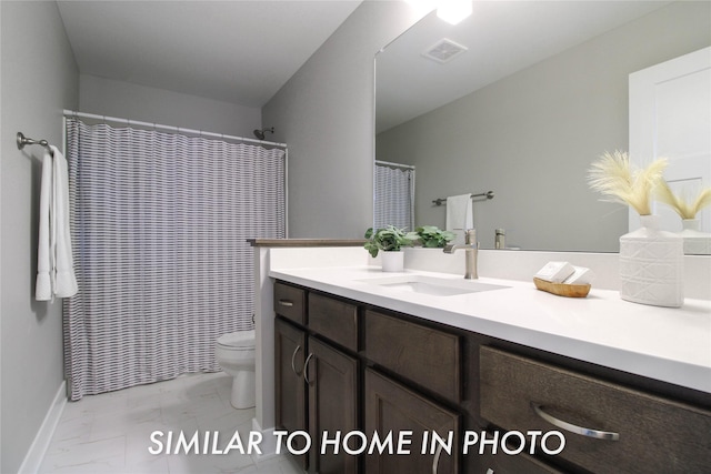 full bathroom with visible vents, toilet, marble finish floor, baseboards, and vanity