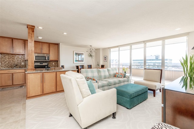 living area with light tile patterned flooring, recessed lighting, and expansive windows