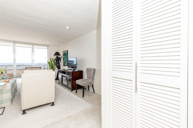 living room with recessed lighting and a textured ceiling