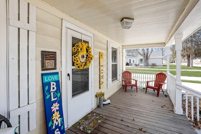 wooden terrace featuring a porch