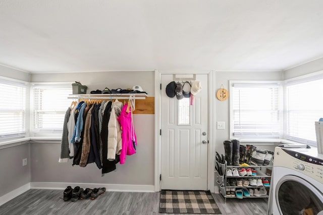 laundry area featuring a wealth of natural light, laundry area, washer / clothes dryer, and baseboards