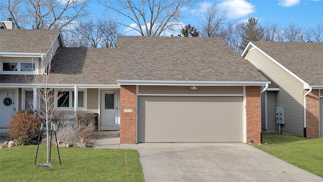 view of front of home with roof with shingles, an attached garage, a front lawn, concrete driveway, and brick siding