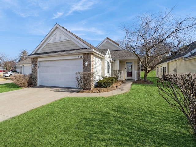 view of front of home with a front yard, a garage, brick siding, and concrete driveway