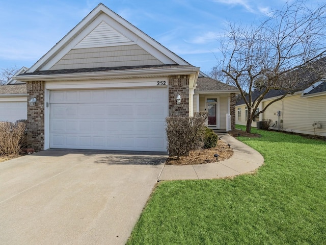 single story home featuring brick siding, concrete driveway, and a front yard