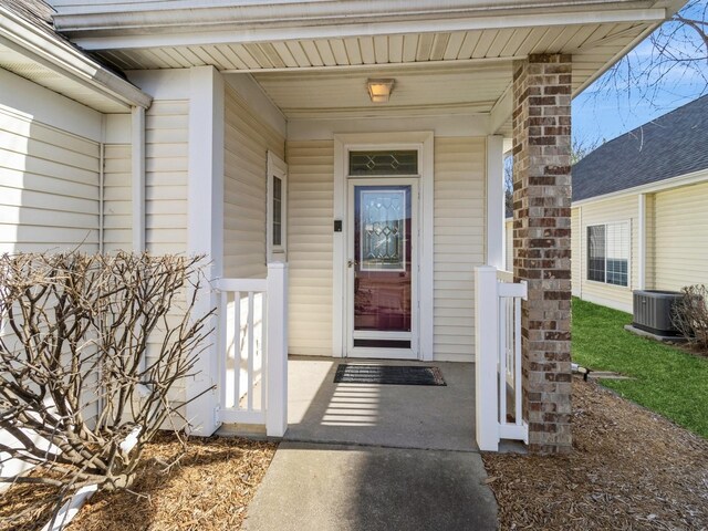 entrance to property with central AC unit and covered porch