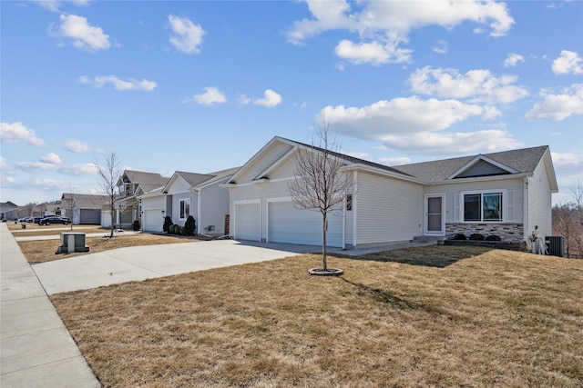 ranch-style house with central air condition unit, driveway, a front lawn, a residential view, and a garage