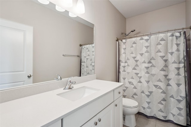 full bath with tile patterned flooring, curtained shower, toilet, and vanity