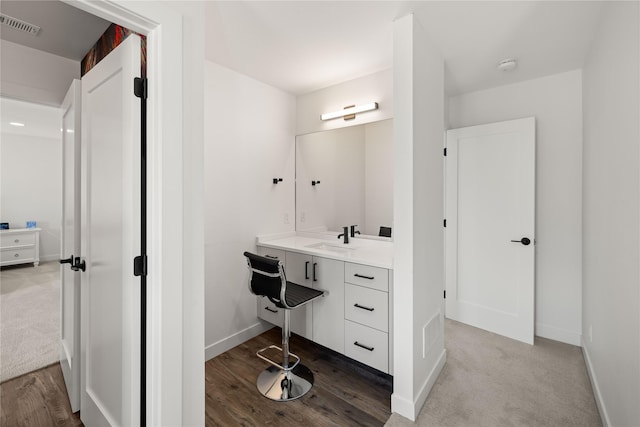 bathroom with vanity, baseboards, and visible vents