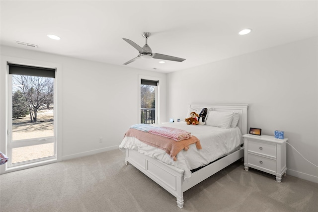 bedroom featuring recessed lighting, baseboards, multiple windows, and carpet floors