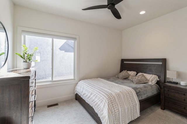 bedroom featuring visible vents, light carpet, recessed lighting, baseboards, and ceiling fan