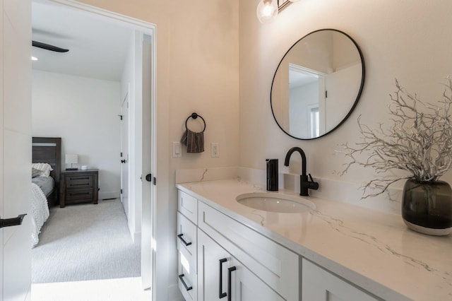 bathroom with vanity and ensuite bathroom