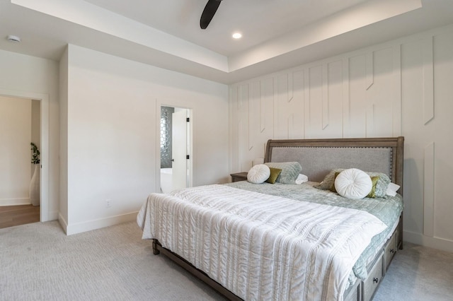 bedroom with ceiling fan, baseboards, a tray ceiling, carpet floors, and recessed lighting