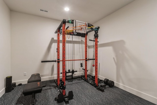 exercise room featuring recessed lighting, baseboards, and visible vents