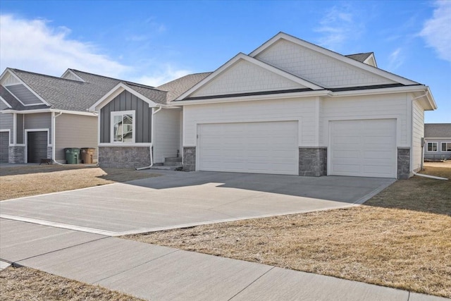 craftsman house featuring stone siding, board and batten siding, concrete driveway, and a garage