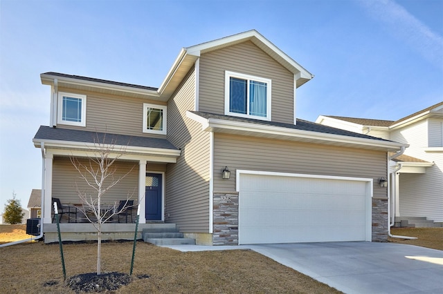 view of front of property featuring concrete driveway, central AC unit, covered porch, a garage, and stone siding