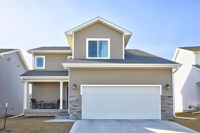 view of front of house featuring stone siding, a porch, concrete driveway, and a shingled roof