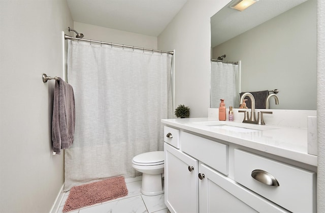 bathroom with marble finish floor, toilet, and vanity