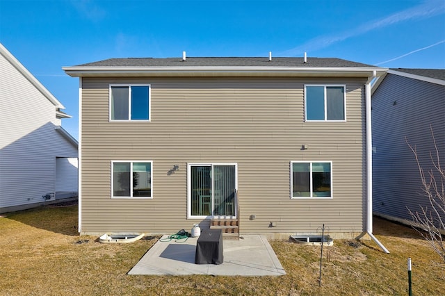 back of house with a yard and a patio area