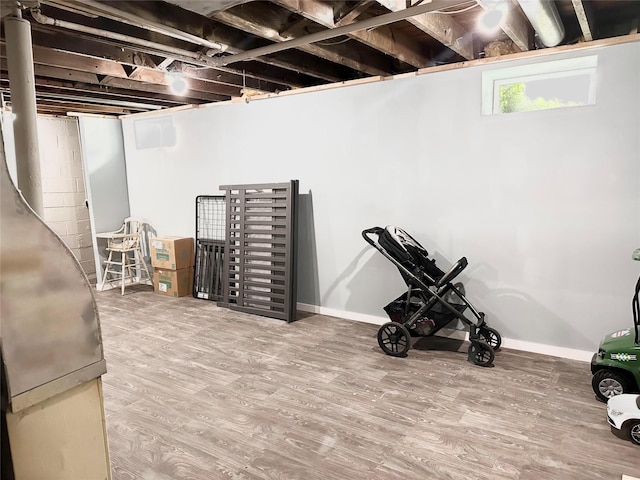 430 S 8th Ave E, Newton, IA 50208 - basement featuring wood finished floors and baseboards