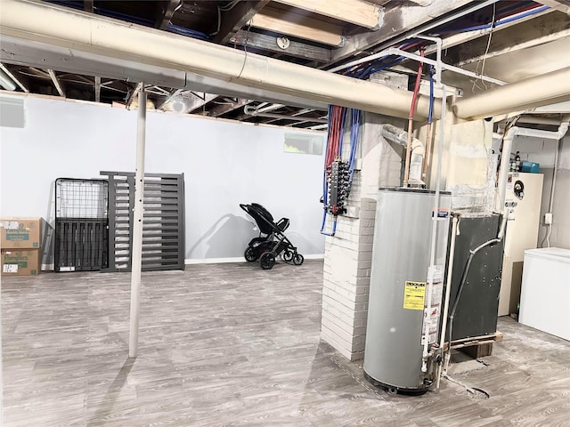 430 S 8th Ave E, Newton, IA 50208 - unfinished basement featuring gas water heater and wood finished floors
