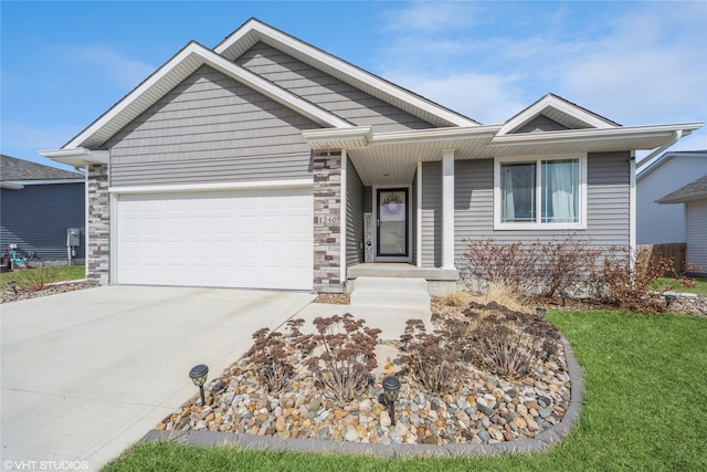 ranch-style home featuring stone siding, an attached garage, and driveway