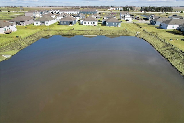 bird's eye view with a residential view and a water view