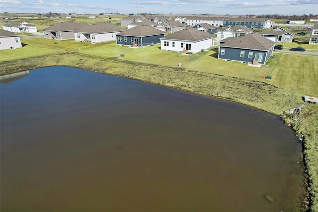 drone / aerial view featuring a residential view and a water view