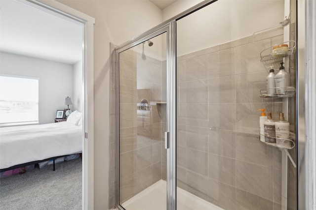 ensuite bathroom featuring a stall shower and ensuite bathroom