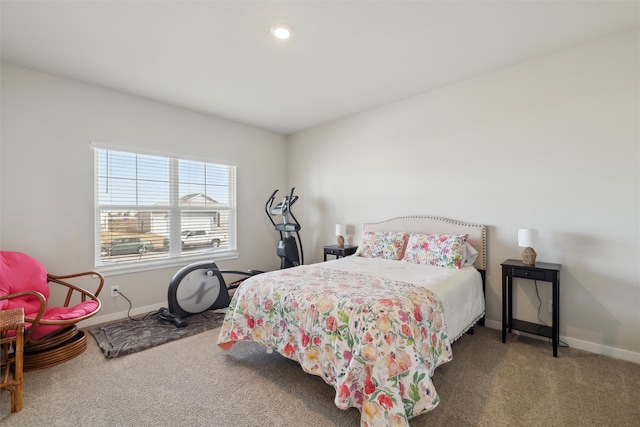 bedroom with carpet flooring and baseboards