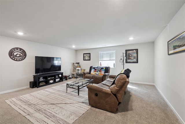 carpeted living area with recessed lighting and baseboards