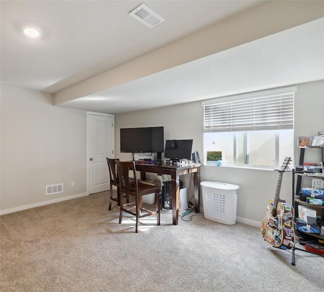 carpeted home office with baseboards and visible vents