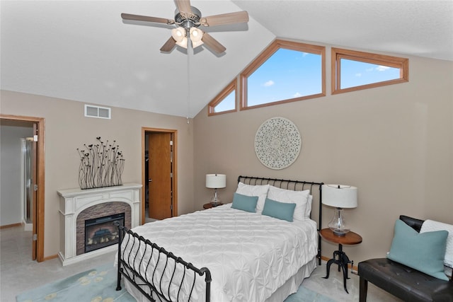 bedroom with baseboards, visible vents, a fireplace, ceiling fan, and carpet flooring