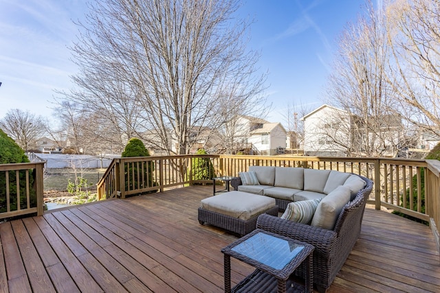 wooden deck featuring an outdoor living space and a residential view