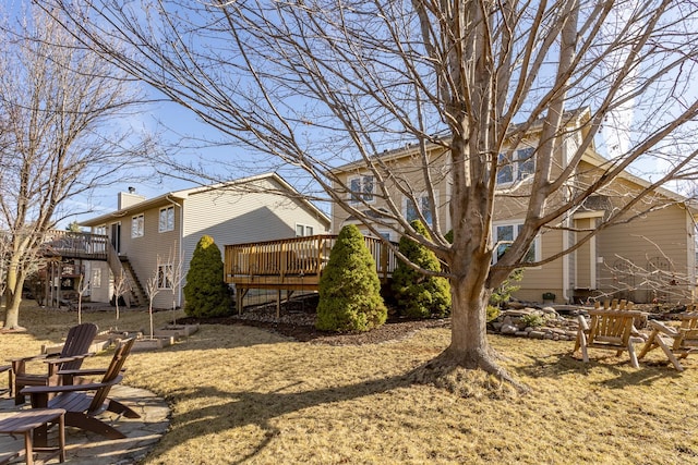 view of yard with stairway and a wooden deck