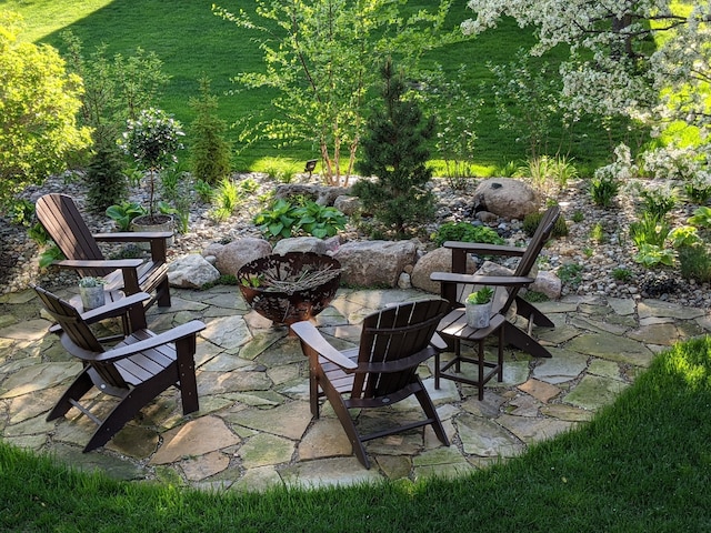 view of patio with a fire pit