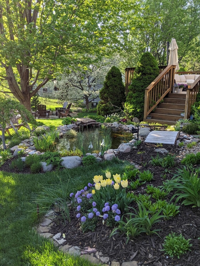 view of yard featuring a small pond