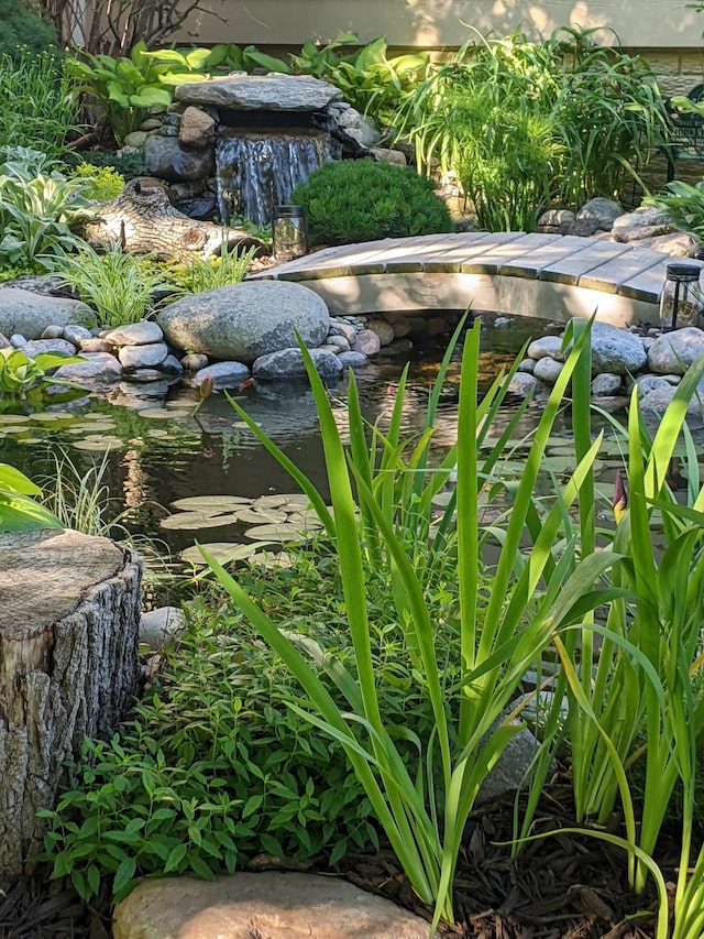 exterior details featuring a garden pond