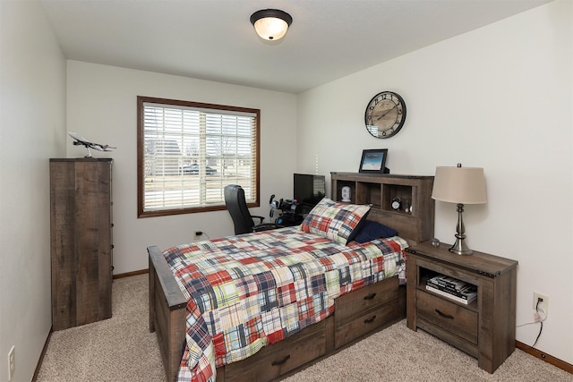 bedroom featuring baseboards and light colored carpet