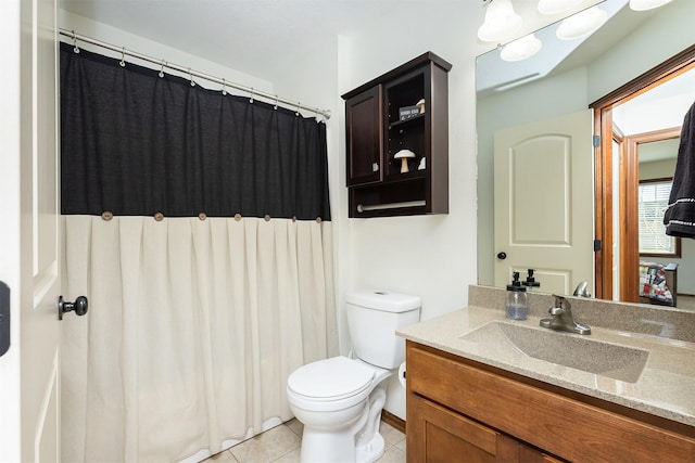 bathroom with tile patterned flooring, toilet, vanity, and a shower with shower curtain